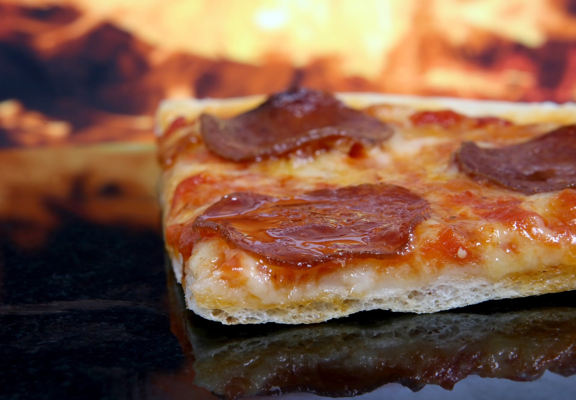 Pizza heiß warm Feuer stück