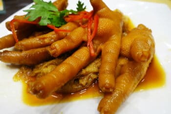 Chinese cooked chicken feet in a white plate / snackconnection