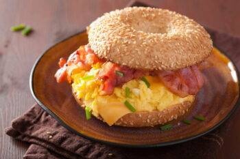 breakfast sandwich on bagel with egg bacon cheese / snackconnection